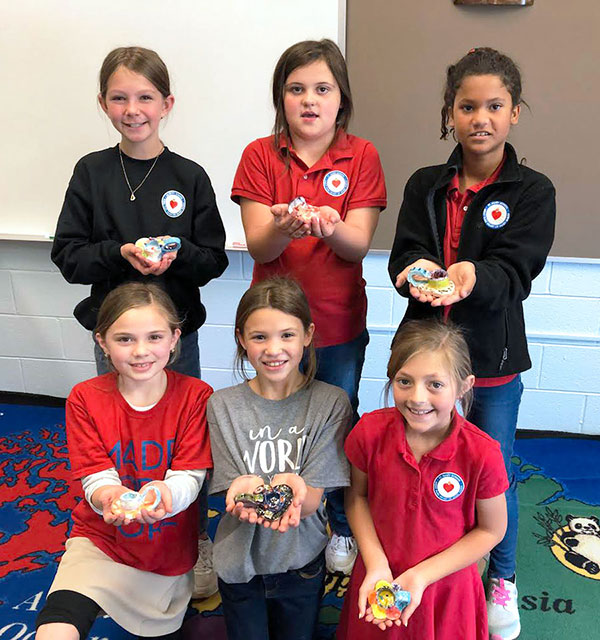 Children with Their Pottery Art